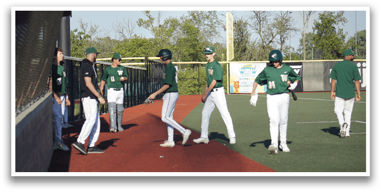 A baseball player is swinging a bat at a ball. Description generated by AI