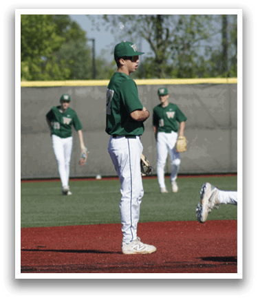 A baseball player in a white uniform is playing in a baseball game. Description generated by AI