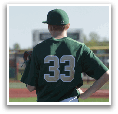 A man and a boy are talking on a baseball field. Description generated by AI