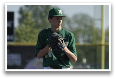 A group of baseball players kneeling on the field. Description generated by AI
