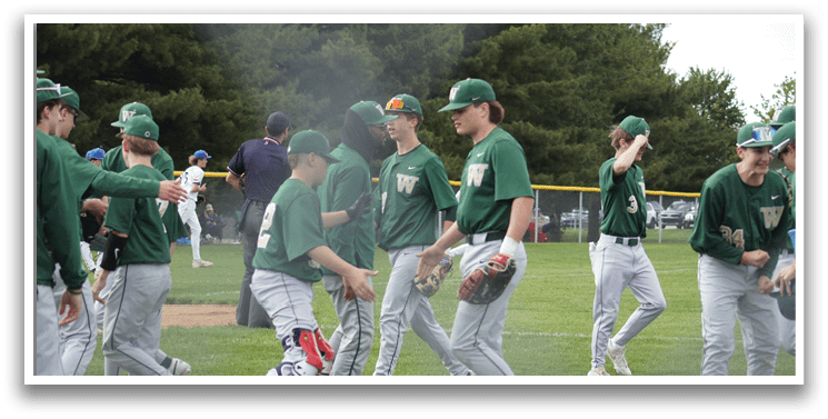 A young boy wearing a baseball glove and a green shirt. Description generated by AI