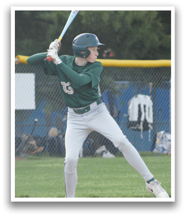 A baseball player in a green and white uniform is pitching a ball. Description generated by AI