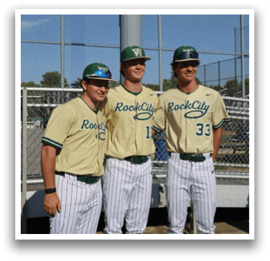 A baseball player wearing a green helmet and white uniform. Description generated by AI