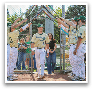 A baseball player wearing a green and white uniform. Description generated by AI