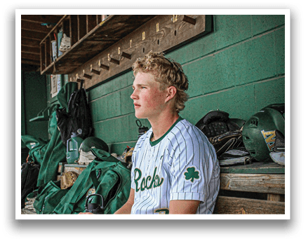 A baseball player wearing a Westfield jersey. Description generated by AI