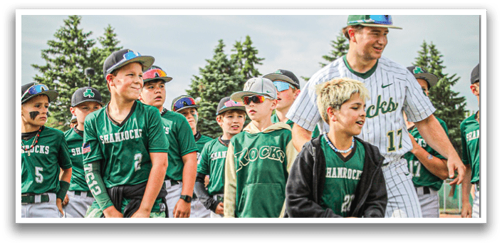 Three baseball players wearing white uniforms and green and white caps. Description generated by AI