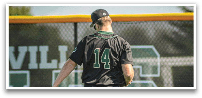 Three baseball players wearing white and green uniforms. Description generated by AI