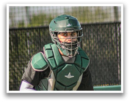 A baseball player in a yellow and green uniform is swinging a bat. Description generated by AI