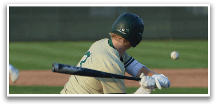 Three baseball players wearing white and green uniforms. Description generated by AI