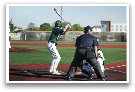 A group of baseball players kneeling on the field. Description generated by AI