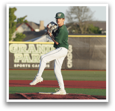 A baseball player wearing a white uniform and a green helmet. Description generated by AI