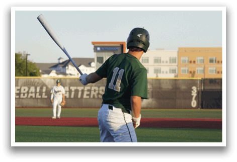 A group of baseball players kneeling on the field. Description generated by AI