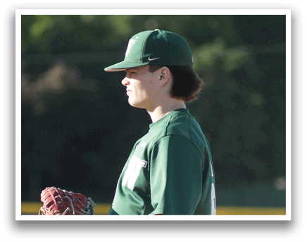 A baseball player in a green and white uniform is holding a bat and getting ready to swing. Description generated by AI