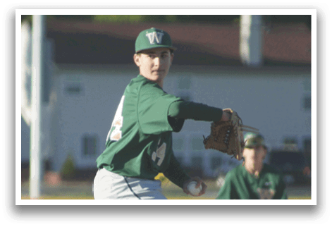 A baseball player is standing at home plate, holding a bat. Description generated by AI