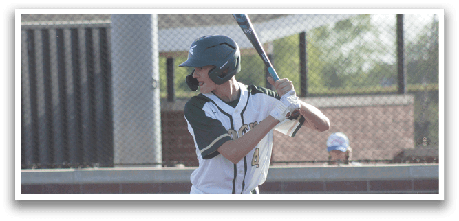 A baseball player wearing a green and white uniform is running towards a base. Description generated by AI