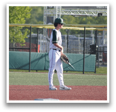 A baseball player sliding into a base. Description generated by AI
