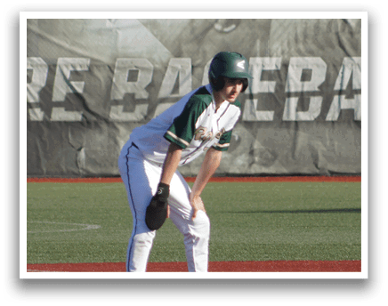 A baseball player in a green and white uniform is holding a bat and getting ready to swing. Description generated by AI