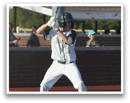 A baseball player in a green and white uniform is holding a bat and getting ready to swing. Description generated by AI
