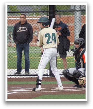 A baseball player in a green and white uniform is pitching a ball. Description generated by AI