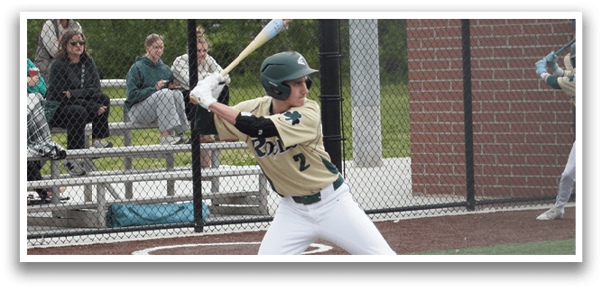 A baseball player wearing a green shirt and white pants is throwing a ball. Description generated by AI