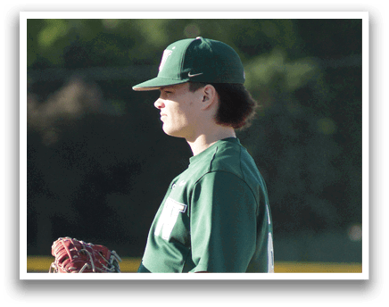 A baseball player in a green and white uniform is holding a bat and getting ready to swing. Description generated by AI