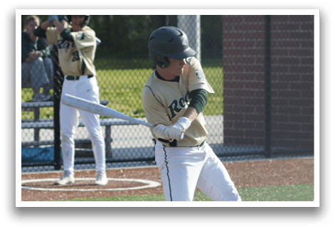 A baseball player is standing at home plate, holding a bat. Description generated by AI