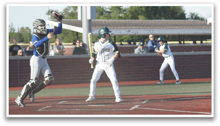 A boy wearing a green shirt and red pants is playing baseball. Description generated by AI