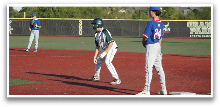 A baseball player slides into home base. Description generated by AI