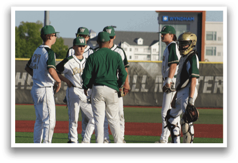 A baseball player is standing at home plate, holding a bat. Description generated by AI