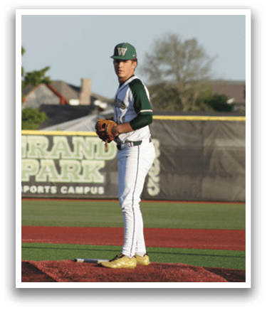 A baseball player in a green shirt and white pants is throwing a ball. Description generated by AI