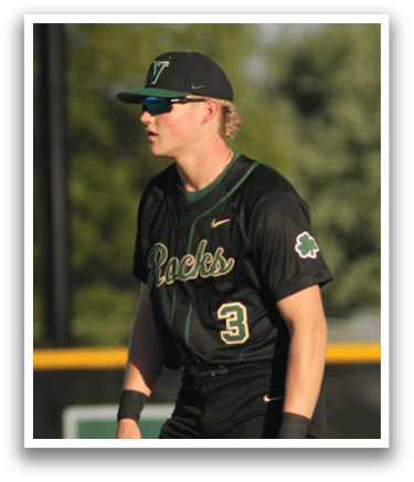 A baseball player is standing on the field. Description generated by AI