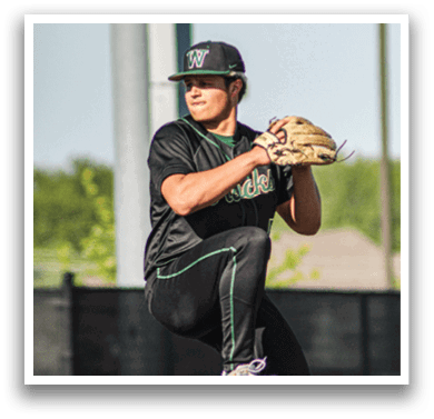 A baseball player wearing a green and white uniform. Description generated by AI