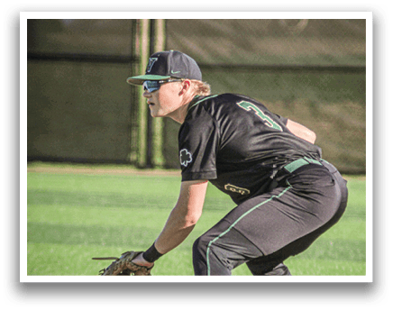 A baseball player in a green and white uniform is pitching a ball. Description generated by AI