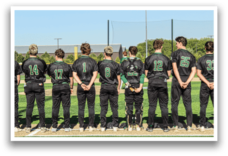 A group of baseball players standing on a field. Description generated by AI
