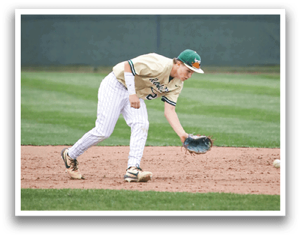 A baseball player wearing a yellow shirt and white pants. Description generated by AI