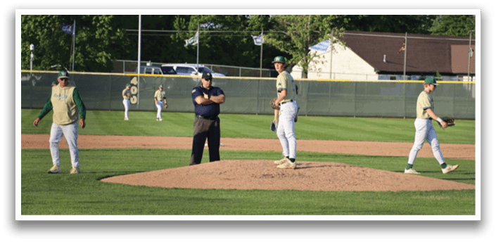 A group of baseball players huddled together on the field. Description generated by AI