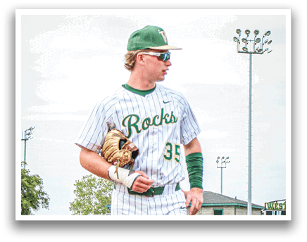 A baseball player wearing a Westfield jersey. Description generated by AI