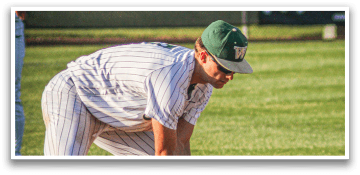 Three baseball players wearing white uniforms and green and white caps. Description generated by AI