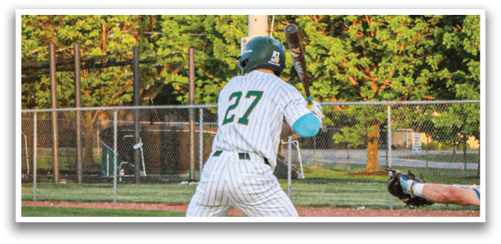 A baseball player wearing a green helmet and white uniform. Description generated by AI