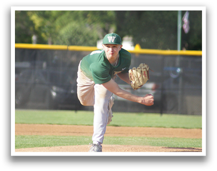A baseball player in a green shirt and white pants is pitching a ball. Description generated by AI