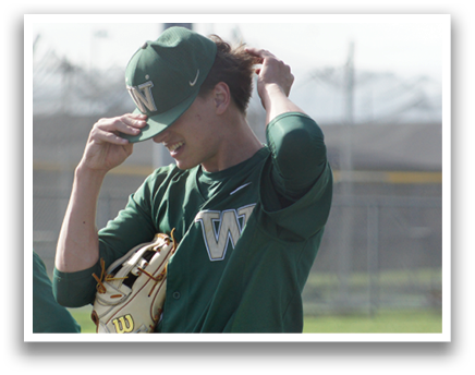 A baseball player wearing a green and white uniform. Description generated by AI