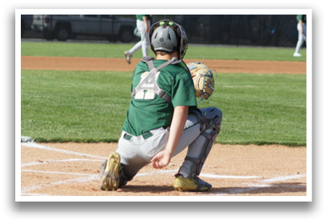 A baseball player is sitting on the ground in the outfield. Description generated by AI