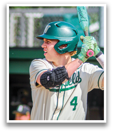 A baseball player wearing a green helmet and holding a bat. Description generated by AI