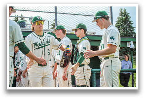 Baseball players standing on a field. Description generated by AI