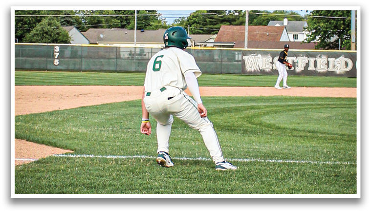 A baseball player in a white uniform is crouching on the field. Description generated by AI