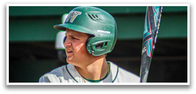 A baseball player holding a bat. Description generated by AI