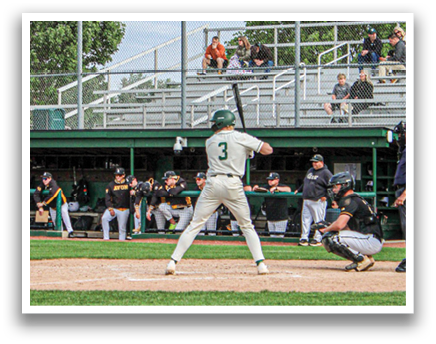 A baseball player is swinging a bat on a field. Description generated by AI