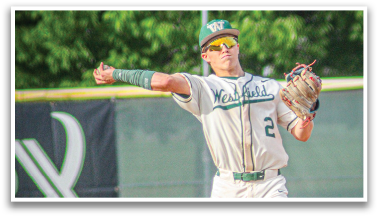 A baseball player wearing a white uniform and a green headband. Description generated by AI