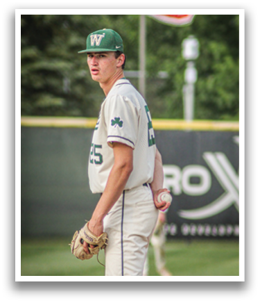 A baseball player wearing a green and white uniform. Description generated by AI