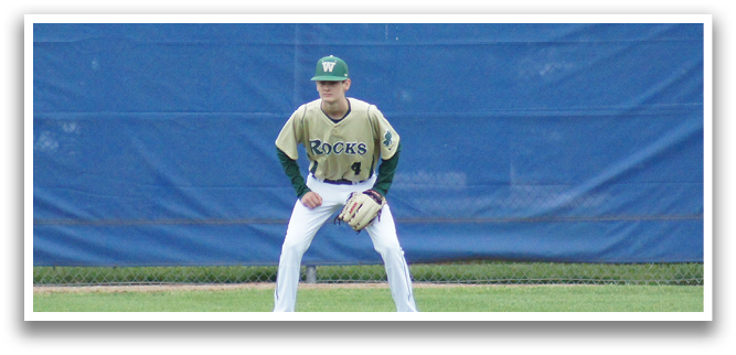 A baseball player wearing a green shirt and white pants is throwing a ball. Description generated by AI